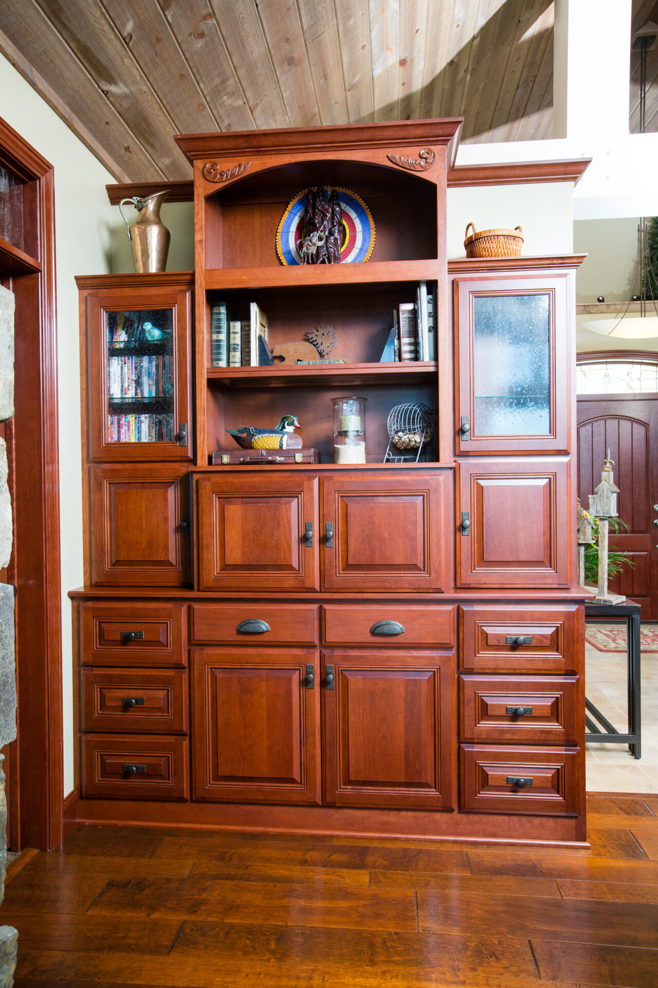 A large wooden cabinet with many drawers and shelves.